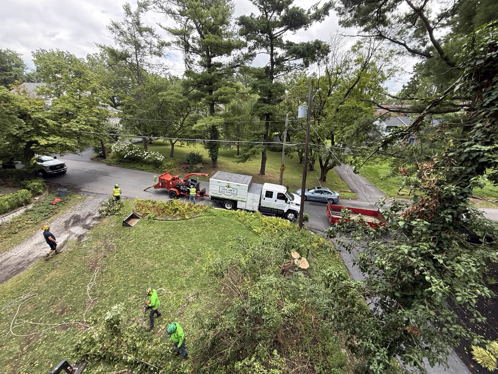 Oscar's Tree Removal truck and chipper on a tree job in Perkasie, PA